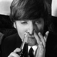 John Lennon sniffs a Pepsi bottle in A Hard Day's Night, 1964