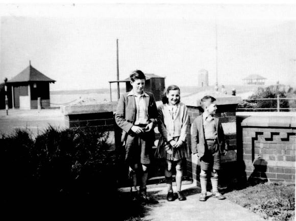 John Lennon with cousins Leila and Stanley Parkes, 1940s