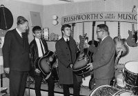 John Lennon and George Harrison receive Gibson J-160E guitars, Rushworth's Music House, Liverpool, September 1962