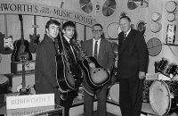 John Lennon and George Harrison receive Gibson J-160E guitars, Rushworth's Music House, Liverpool, September 1962