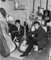 John Lennon and George Harrison receive Gibson J-160E guitars, Rushworth's Music House, Liverpool, September 1962