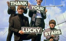 The Beatles holding 'Thank Your Lucky Stars' signs on 18 August 1963