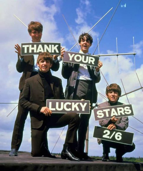 The Beatles holding 'Thank Your Lucky Stars' signs on 18 August 1963