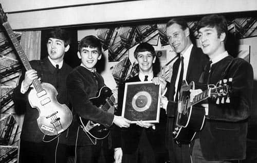 The Beatles receive their first silver disc. With George Martin, 5 April 1963