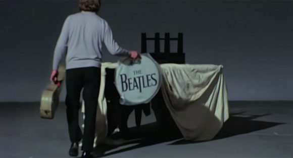 Mal Evans carrying a Beatles drum head – Twickenham Film Studios, 2 January 1969