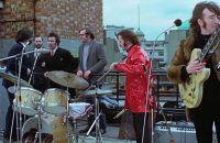Michael Lindsay-Hogg, Peter Brown, Jimmy Clark, Mal Evans, Ringo Starr, John Lennon – Apple rooftop, 30 January 1969