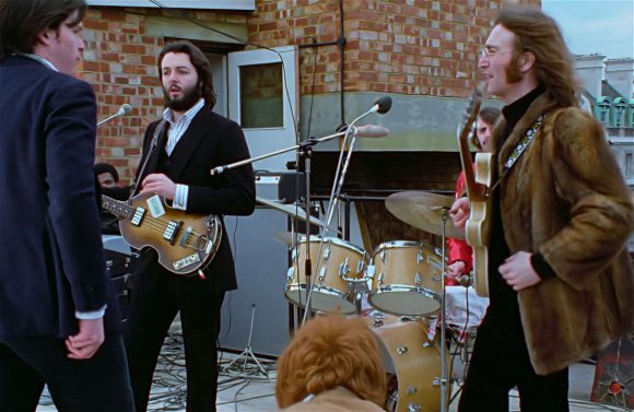 Michael Lindsay-Hogg, Paul McCartney, Ringo Starr, John Lennon – Apple rooftop, 30 January 1969