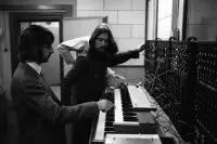 Ringo Starr and George Harrison playing a Moog synthesiser, 1969
