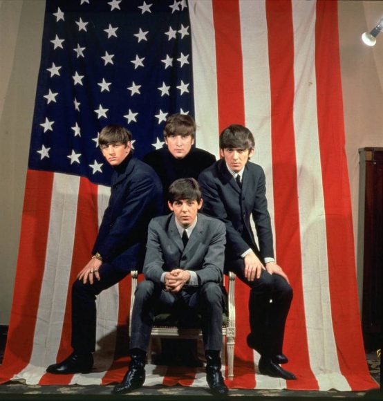 The Beatles with a USA flag, 1964