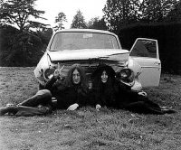 John Lennon and Yoko Ono with their crashed Austin Maxi, Tittenhurst Park, 1969