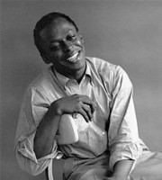 220px-Miles_Davis_by_Palumbo_cropped.jpg